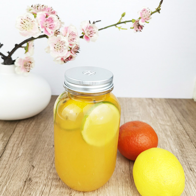 ظروف شیشه ای پلاستیکی 0.5 لیتری نوشیدنی با درپوش ظروف آبمیوه گرد شفاف